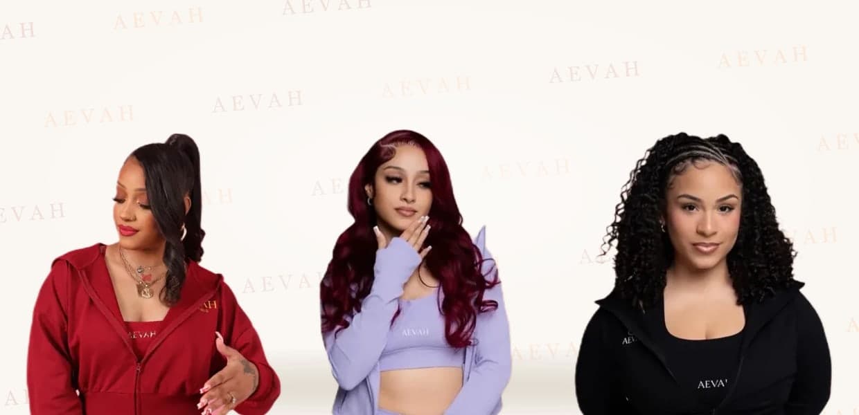 Three women in the AEVAH red, lilac and black sets on the AEVAH backdrop