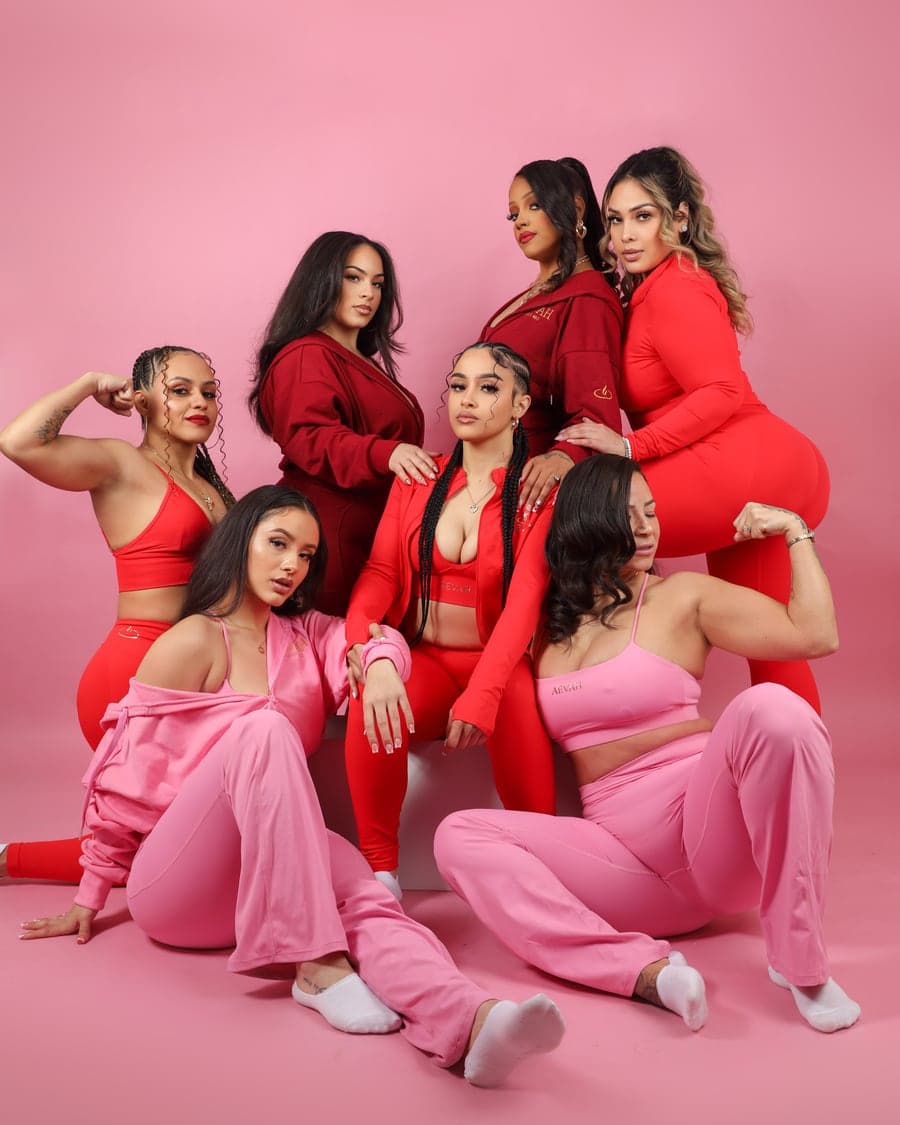 Seven women in the AEVAH red and pink sets