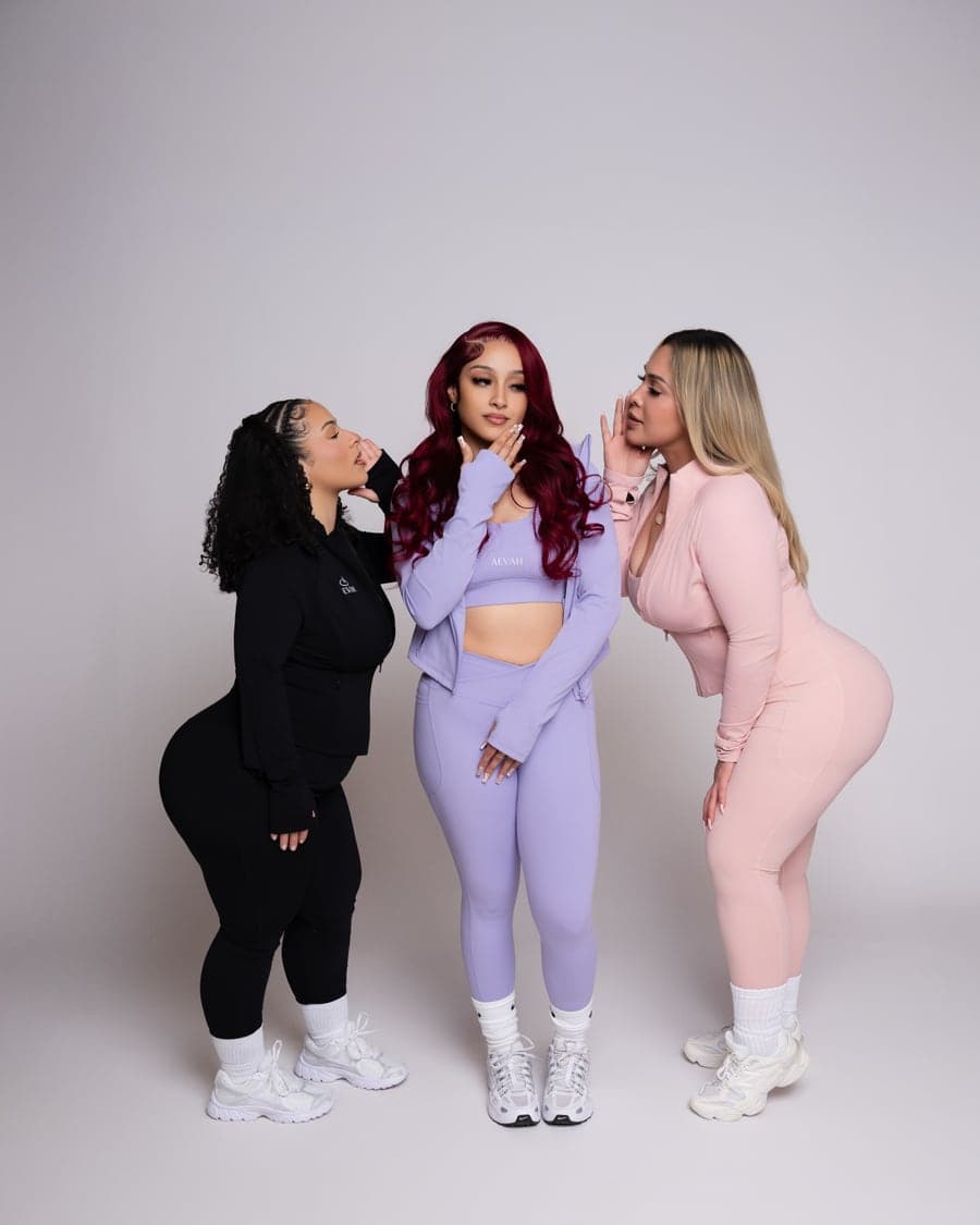 Three women in the AEVAH black, lilac and blush sets